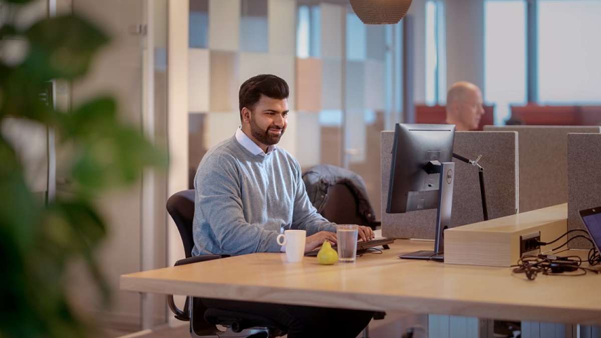 A man working on a computer in an office